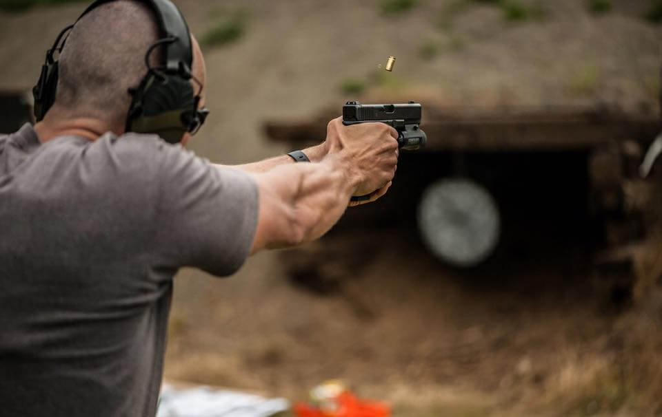 Gun owner practicing firearm safety rules