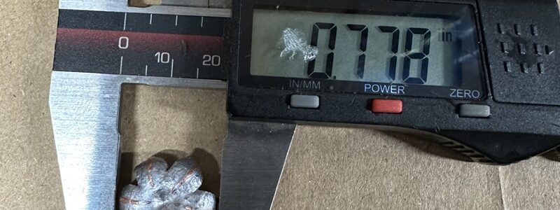 A bullet being measured.