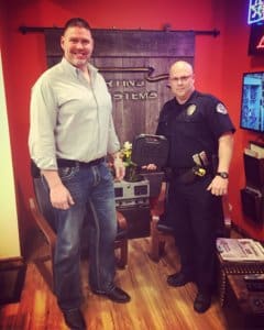 Dan with officer who won a contest