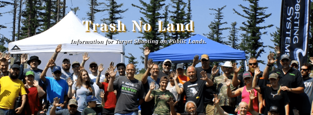 A large group of people on a sunny day waving to help illustrate Trash No Land